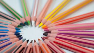 spectrum of colored pencils arranged in a circle