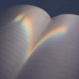 lined notebook with shadow on pages