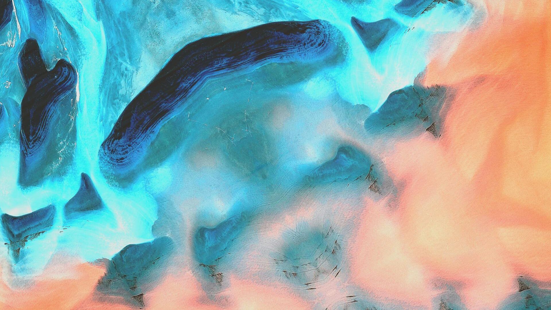 abstract image with blue and orange shapes gently merging