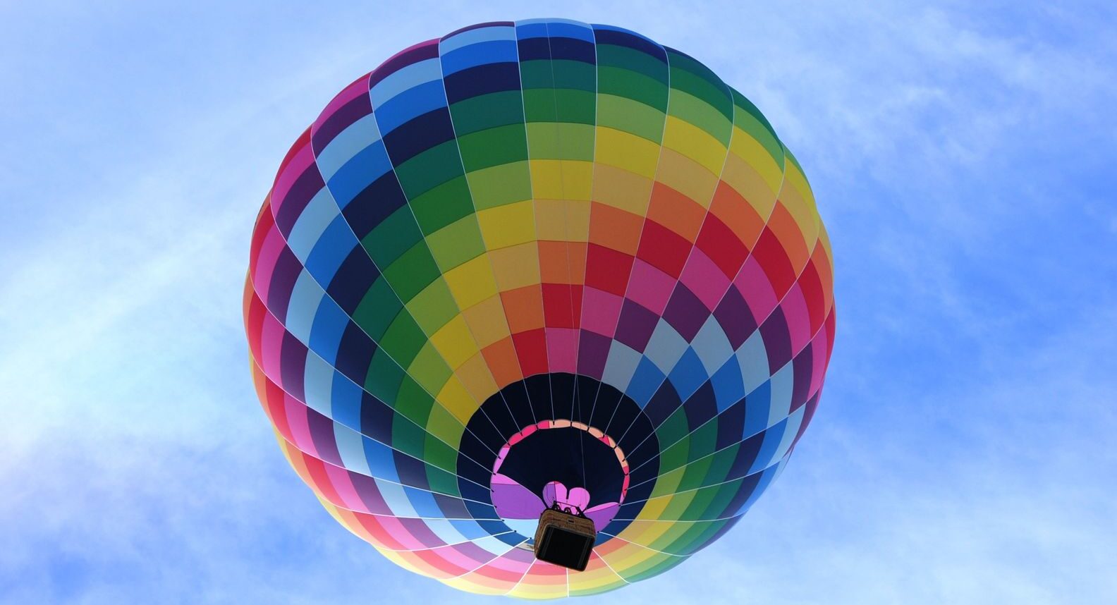 hot air balloon flying under blue sky during daytime